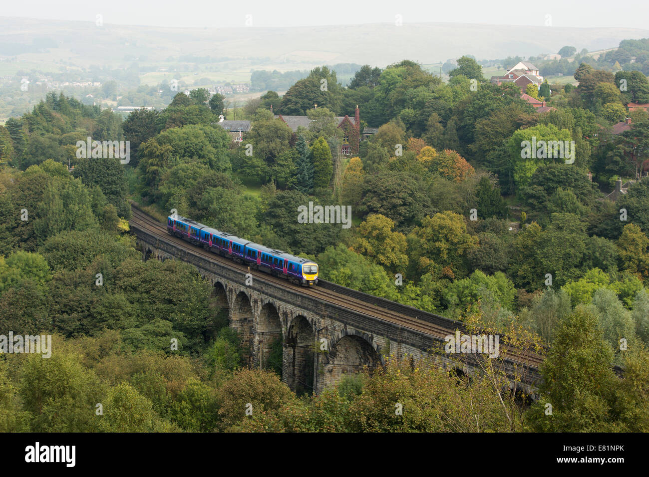 First Trans-Pennine Express diesel multiple unit (DMU) travelling across the Saddleworth Viaduct, Uppermill, Lancashire UK Stock Photo