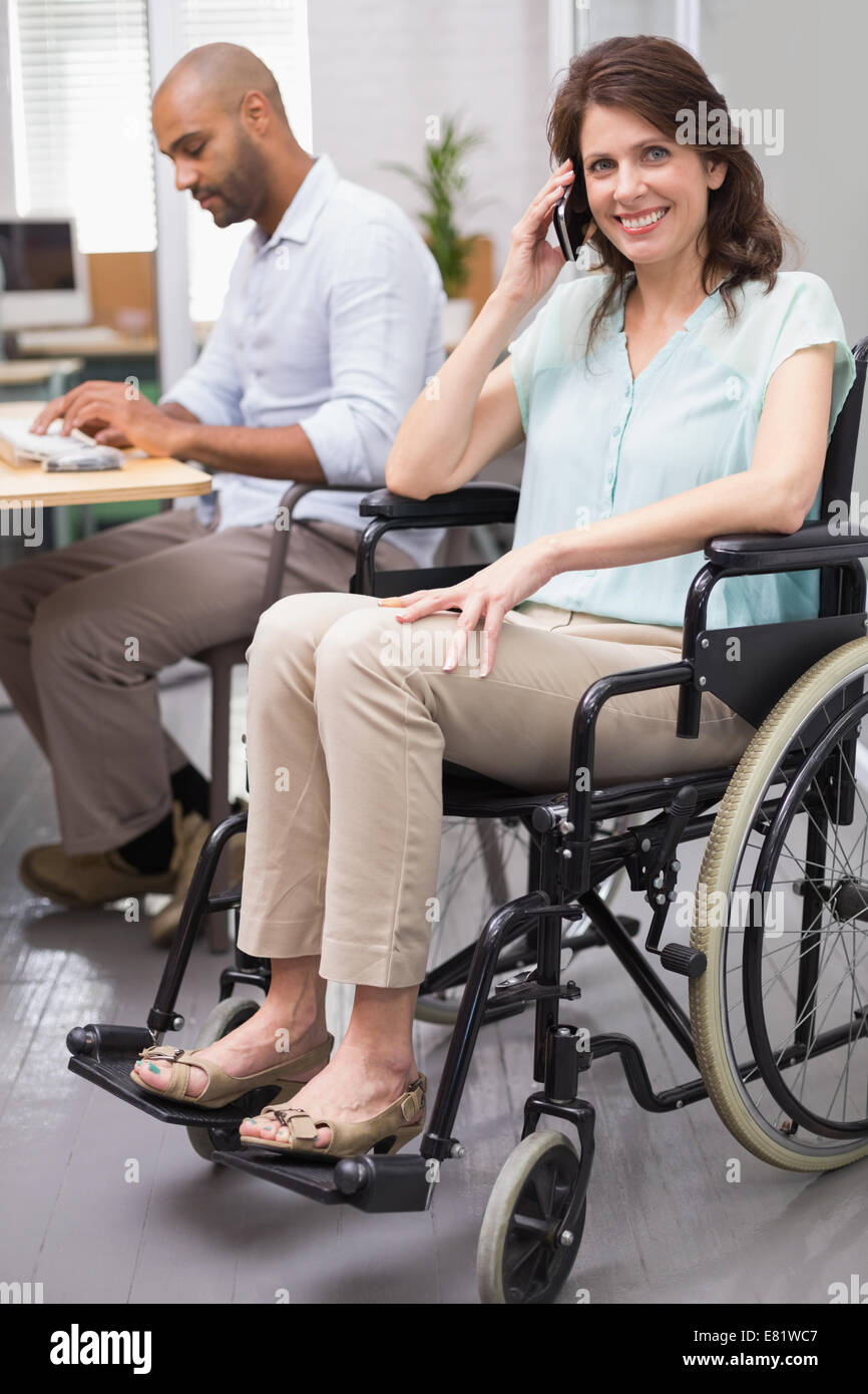 Smiling businesswoman in wheelchair on the phone Stock Photo - Alamy