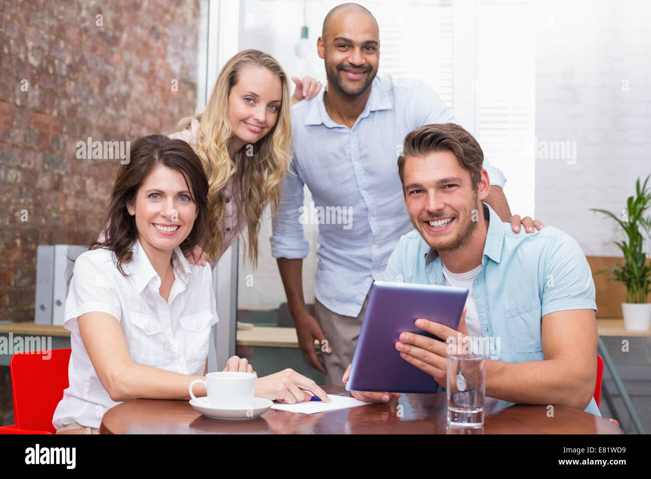 Business team having a meeting with tablet pc Stock Photo