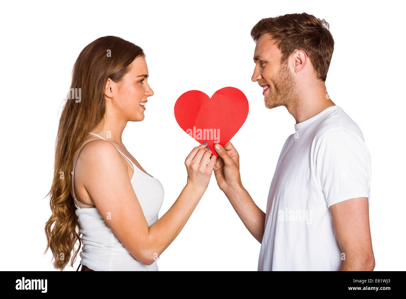 Romantic young couple holding heart Stock Photo