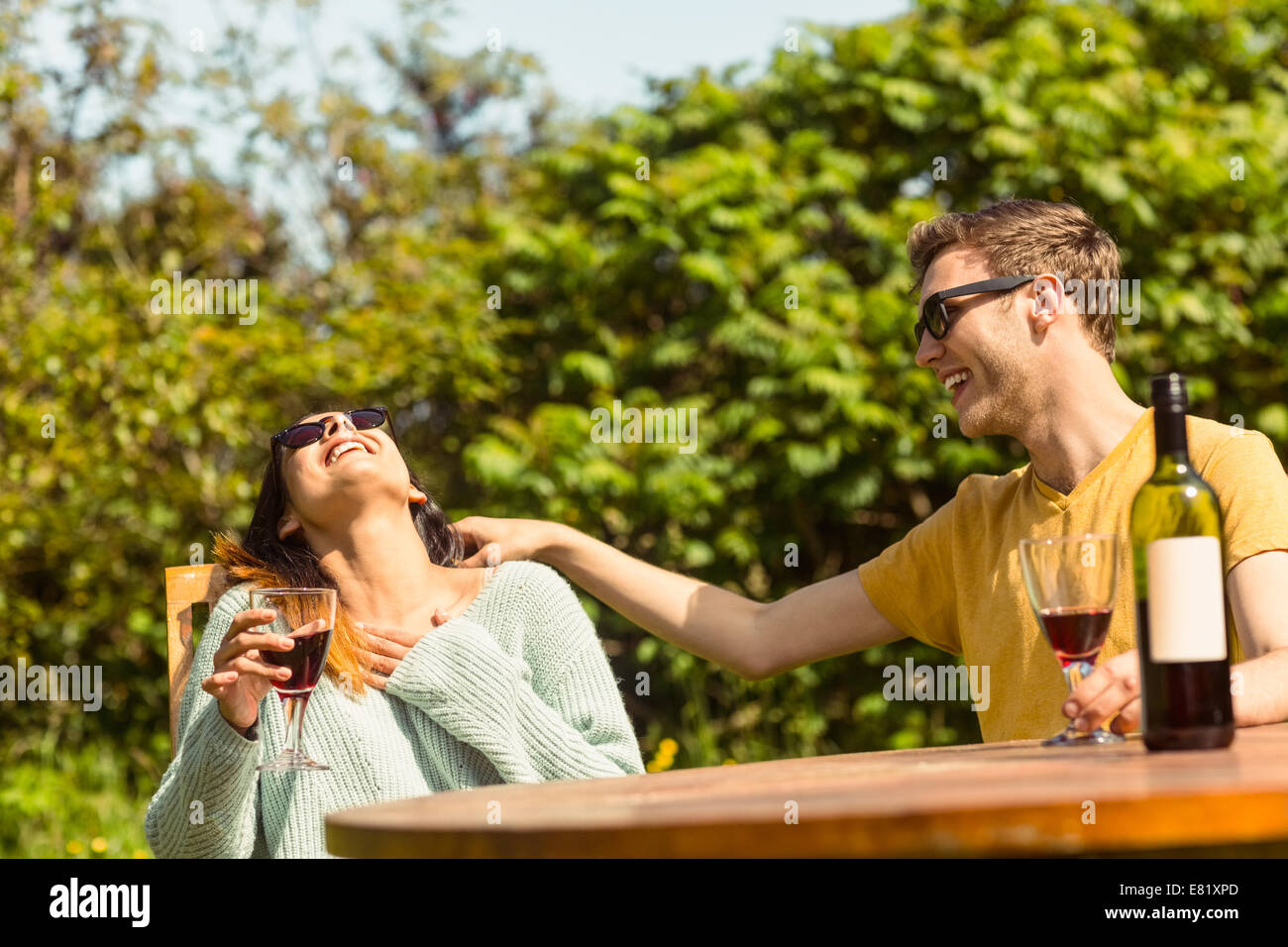 Young couple enjoying red wine Stock Photo