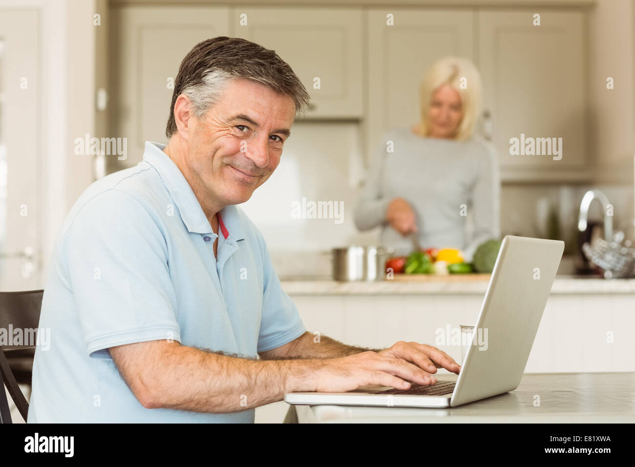 Happy mature man laptop hi-res stock photography and images - Alamy
