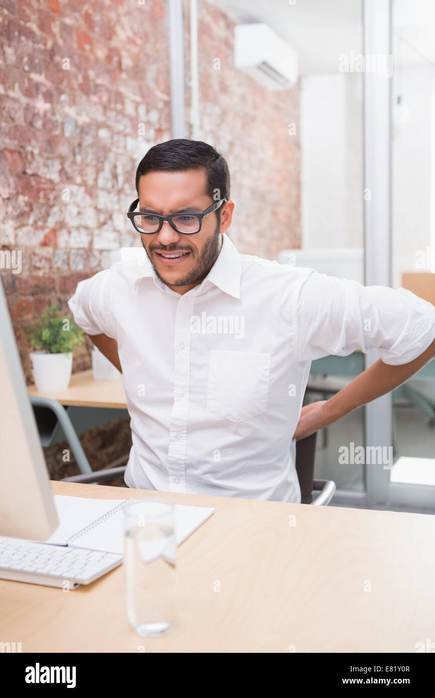 Hackache Businessman painful backache sitting hi-res stock photography and ...