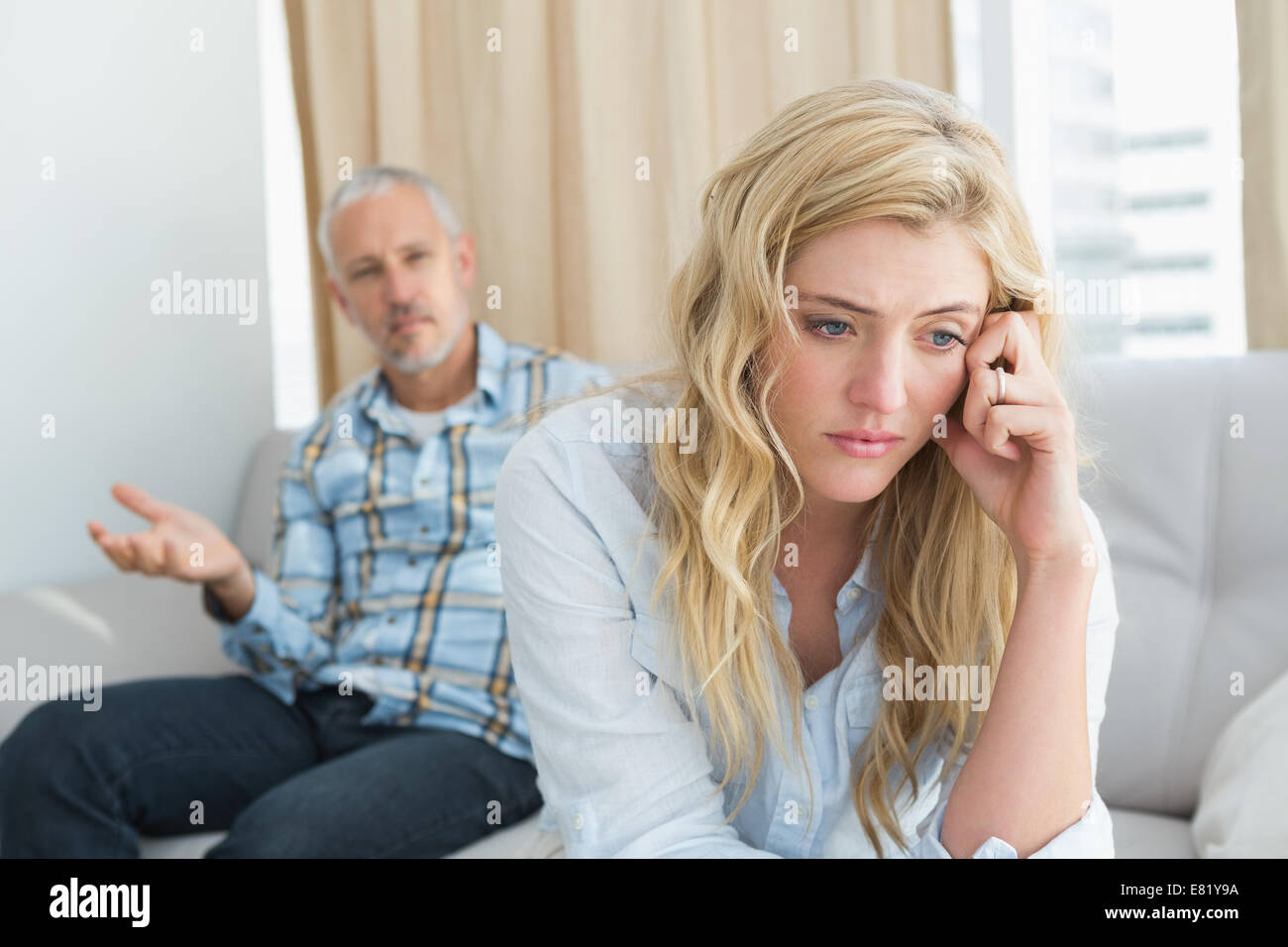 Couple arguing on the couch Stock Photo - Alamy
