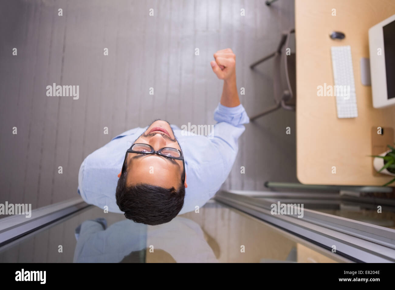 Mixed race man cheering office hi-res stock photography and images - Alamy