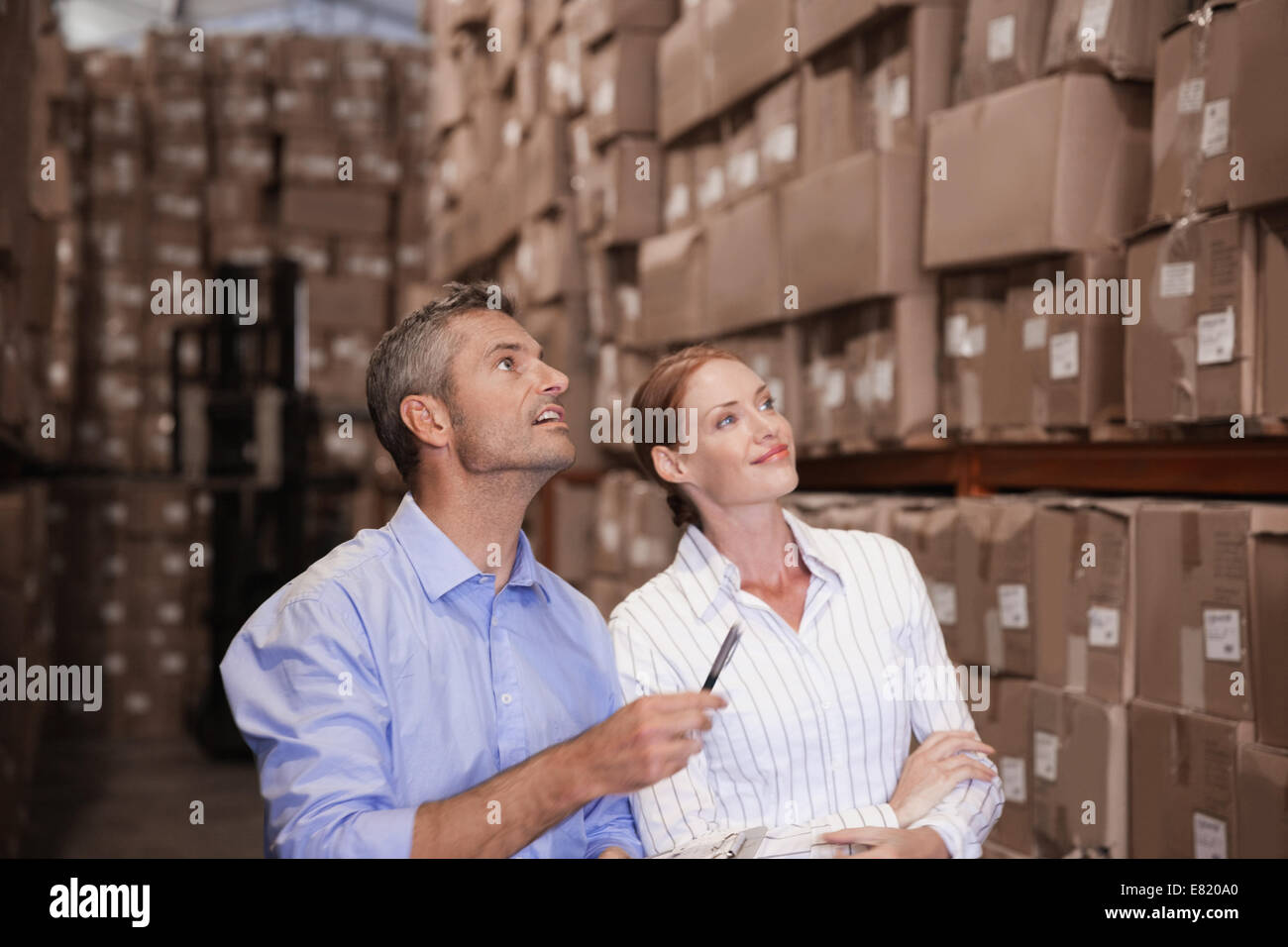 Warehouse team working together Stock Photo - Alamy