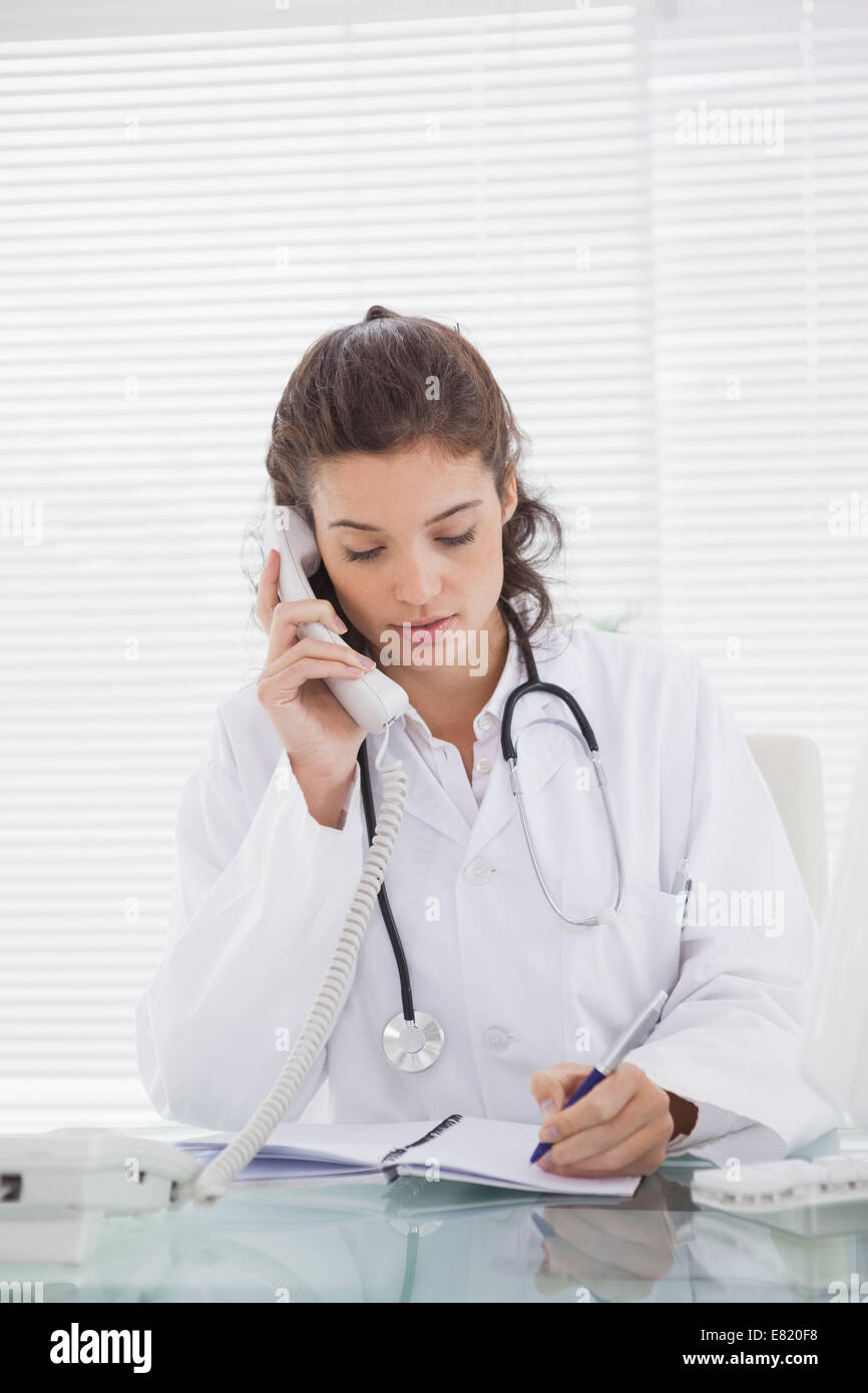 Female doctor takes notes hi res stock photography and images Alamy