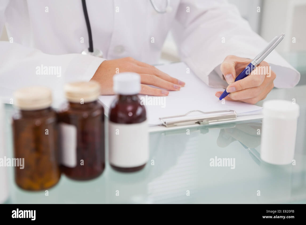 Vet writing on clipboard the prescriptions Stock Photo Alamy