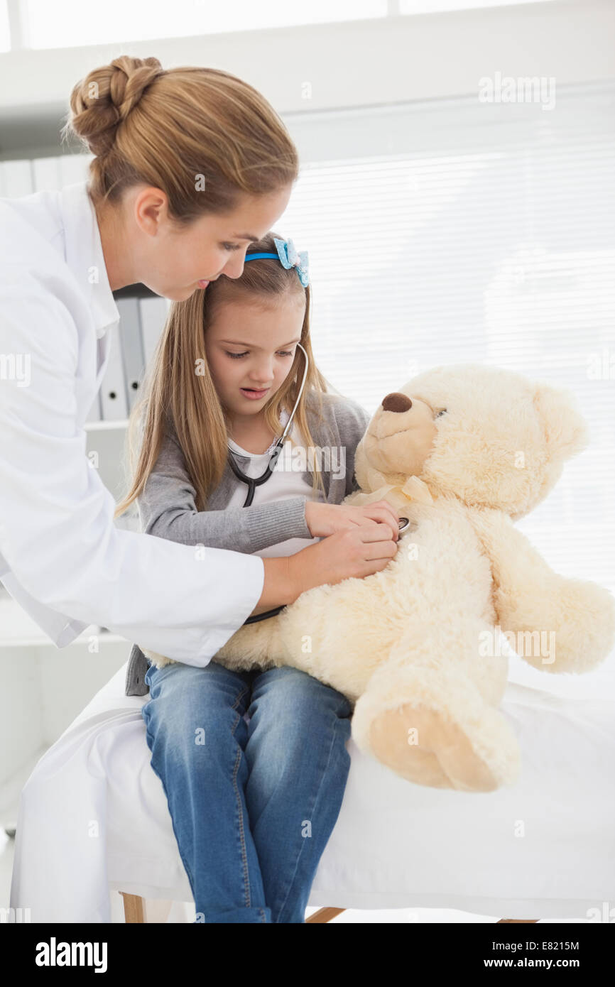 Doctor giving a patient a stuffed bear Stock Photo