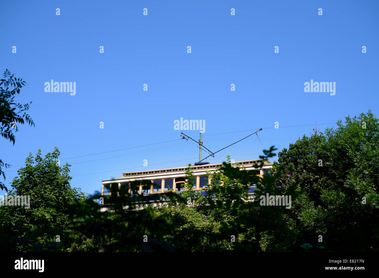 BALLAGLASS GLEN, ISLE OF MAN, 23rd July 2014. IOM Electric Railway tram passing through countryside in summer Stock Photo