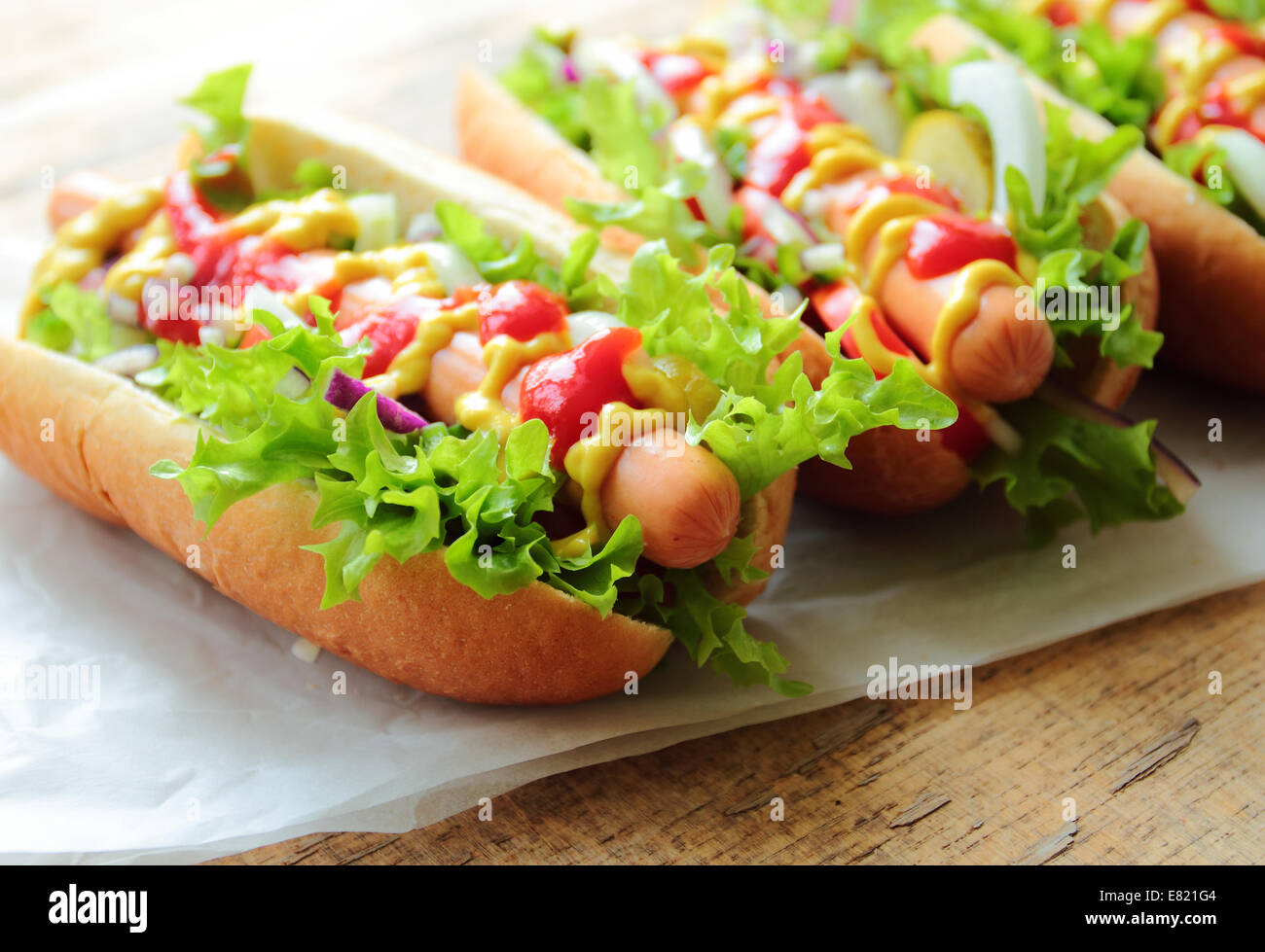 Hot dog with fresh sausage and vegetables Stock Photo