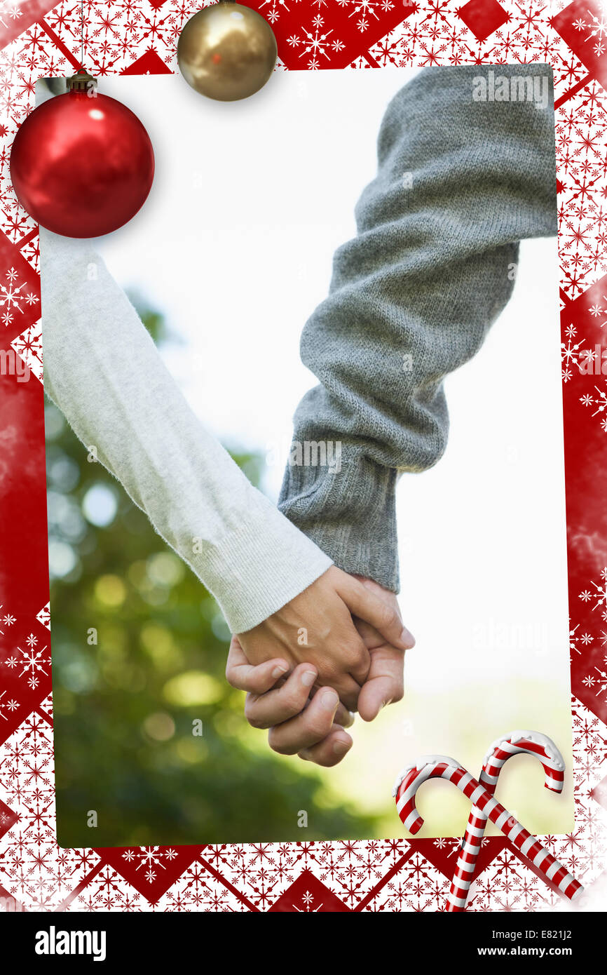 Cute couple holding hands in the park Stock Photo - Alamy