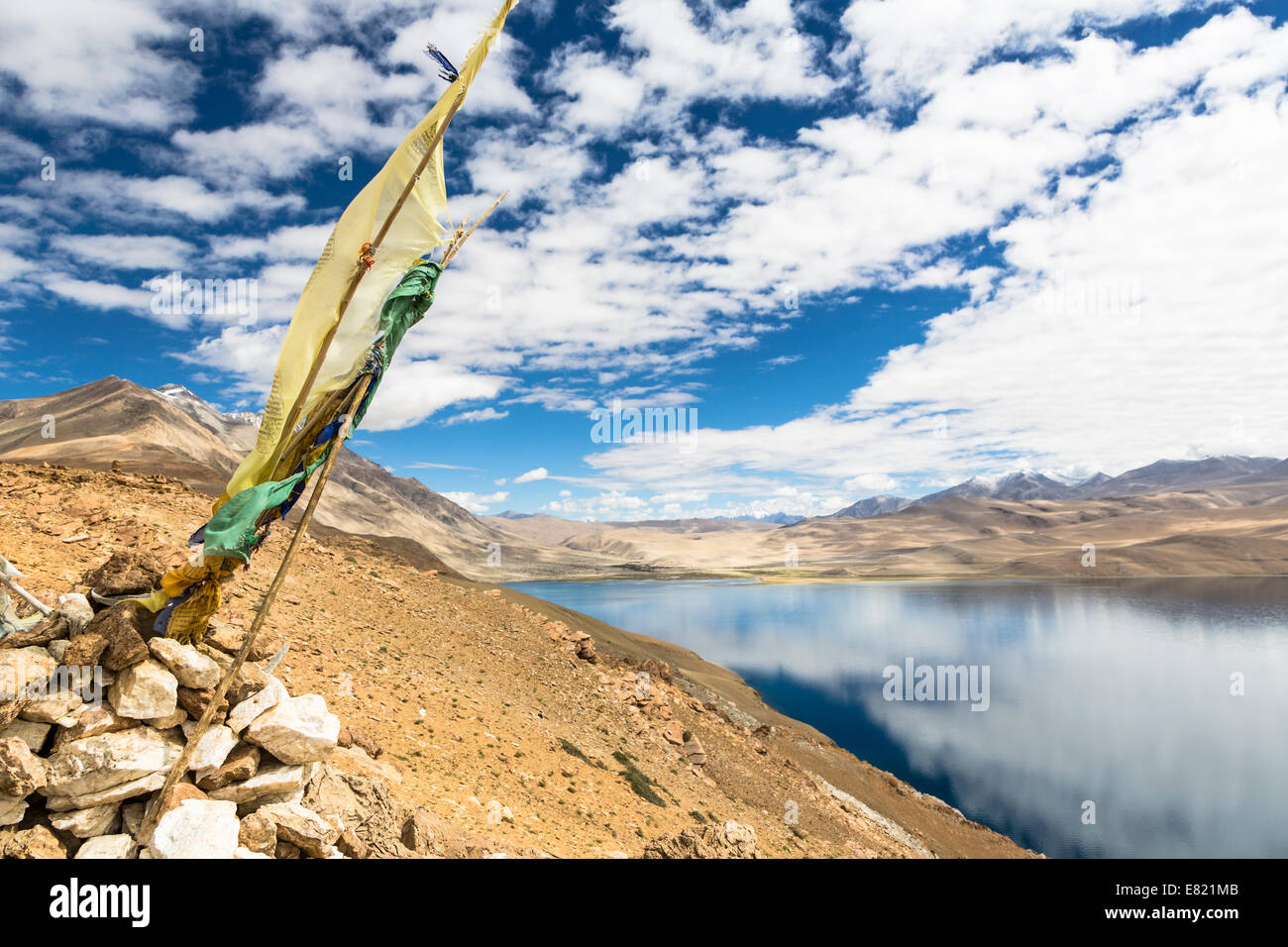 Tibetan prayer flag overlooking Tso Moriri (lake Moriri) in Ladakh, India Stock Photo