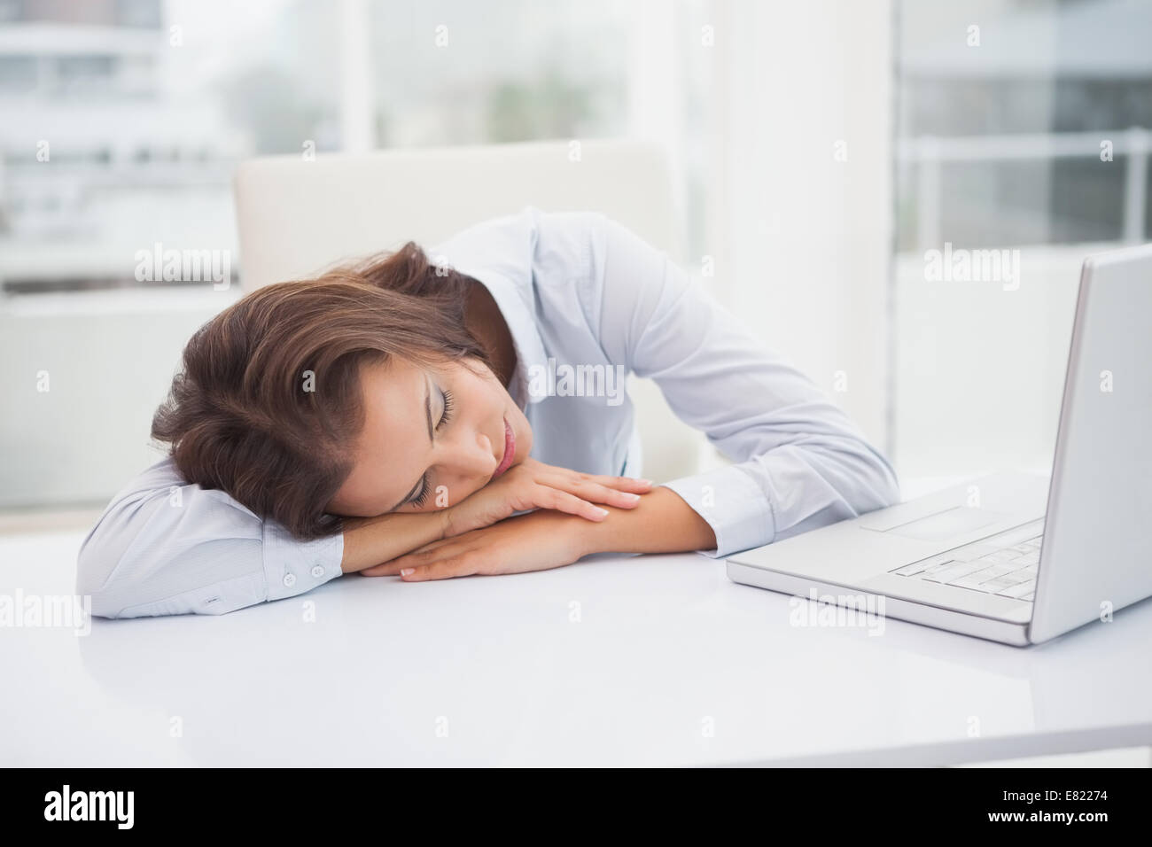 Tired businesswoman sleeping at her desk Stock Photo - Alamy
