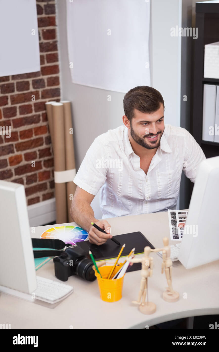 Cheerful designer working on graphics hi-res stock photography and ...