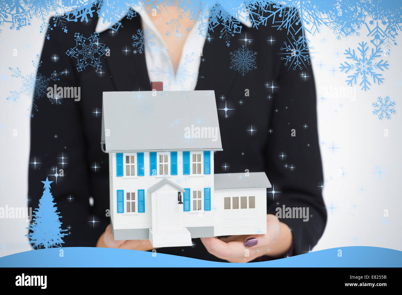 Real estate agent holding a model house Stock Photo Alamy