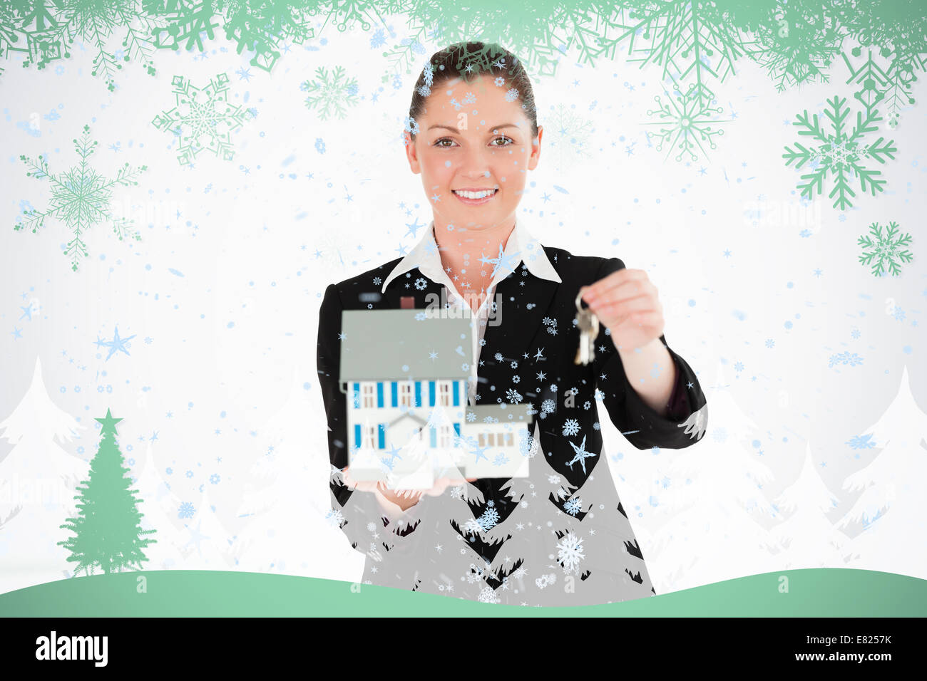Good looking woman in suit holding keys and a miniature house Stock ...