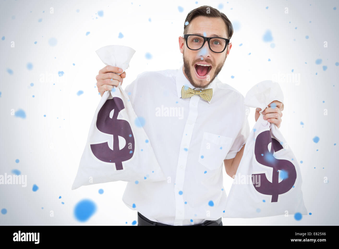Geeky businessman holding money bags Stock Photo Alamy