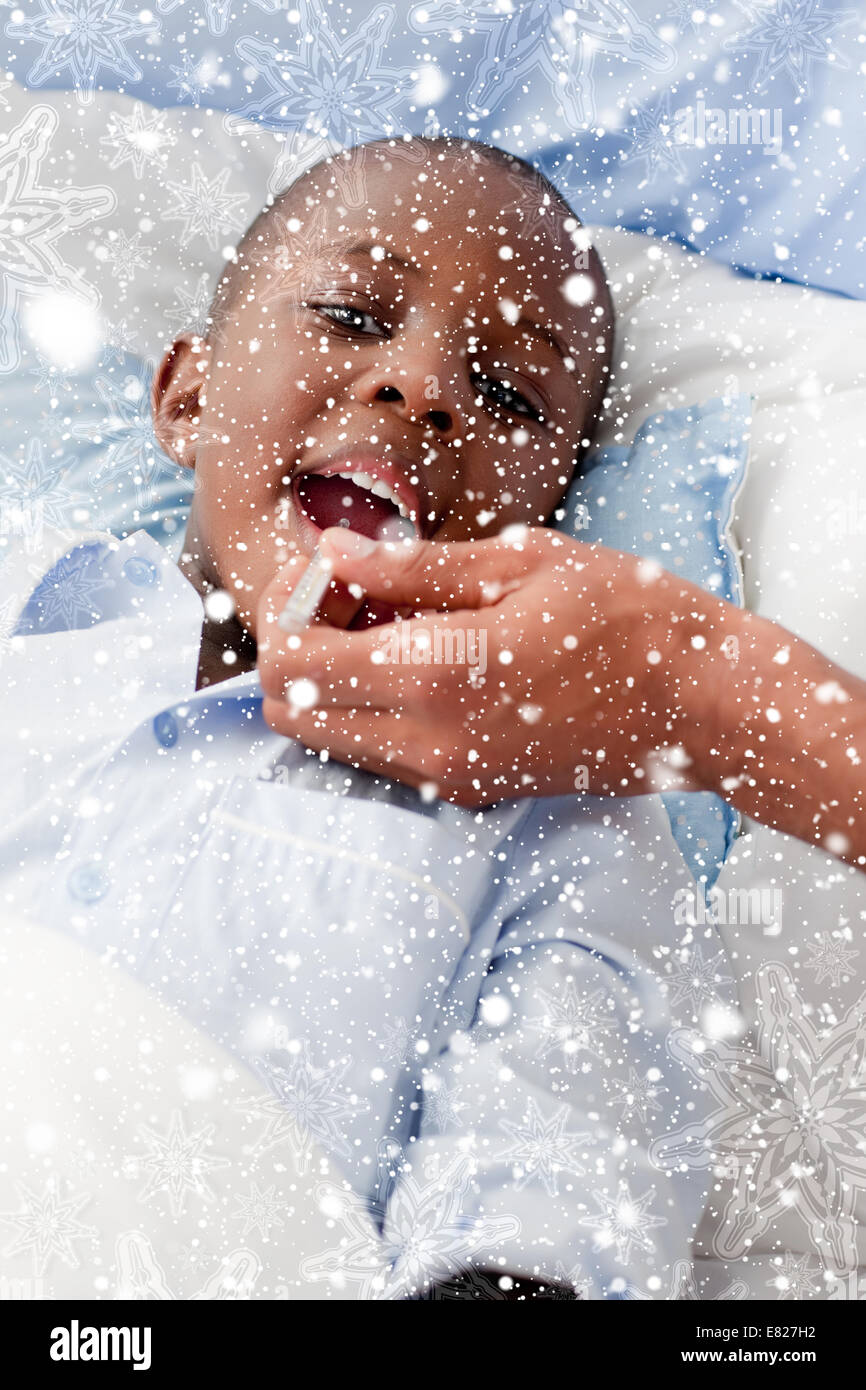 Composite image of small boy sick in bed Stock Photo