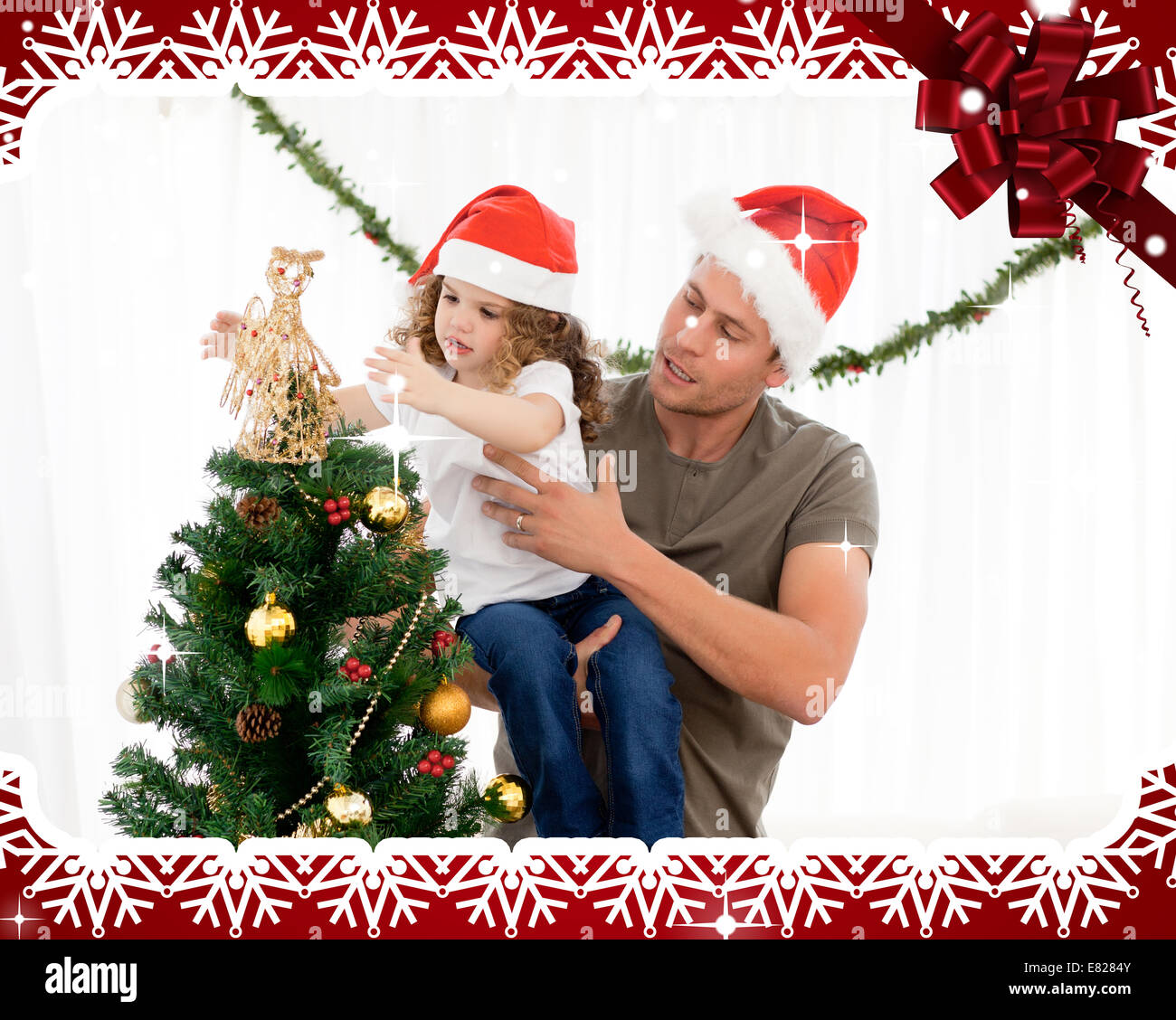 Cute daughter decorating the christmas tree with his father Stock Photo ...