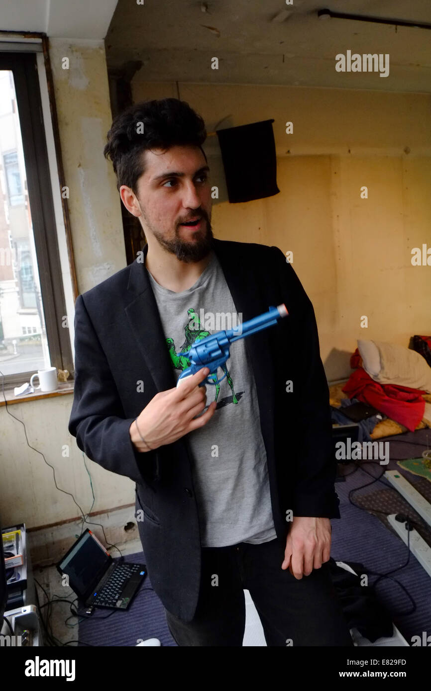 Amir Taaki, creator of Dark wallet with toy gun Stock Photo - Alamy