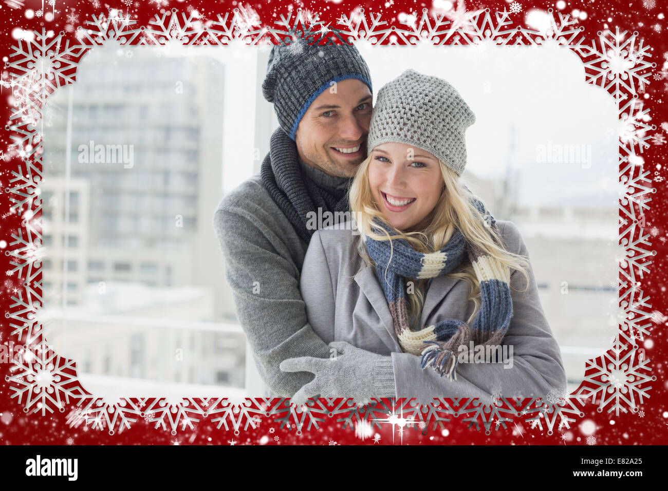 Cute couple in warm clothing smiling at camera Stock Photo - Alamy
