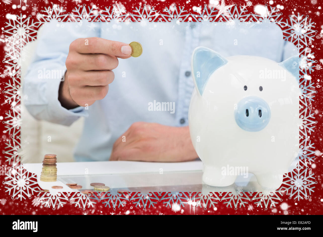 Mid section of a man putting some coins into a piggy bank Stock Photo ...