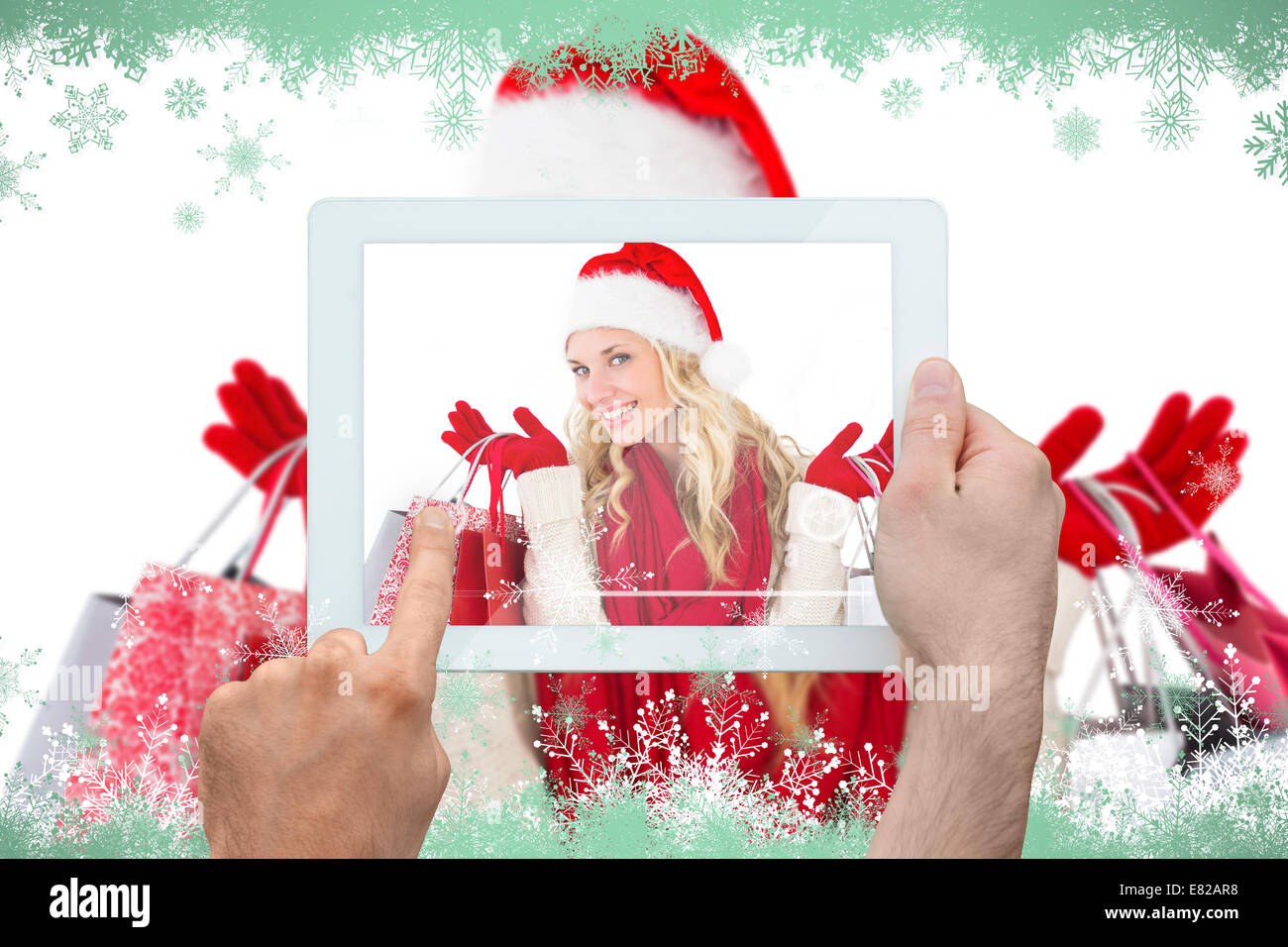 Composite image of hand holding tablet pc Stock Photo - Alamy