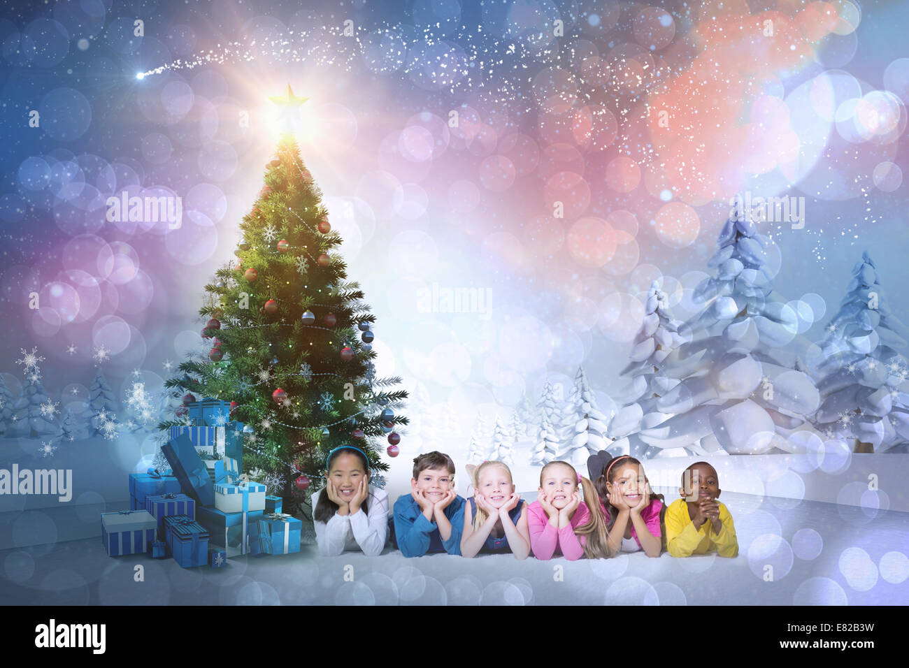 Composite image of cute children smiling at camera Stock Photo - Alamy