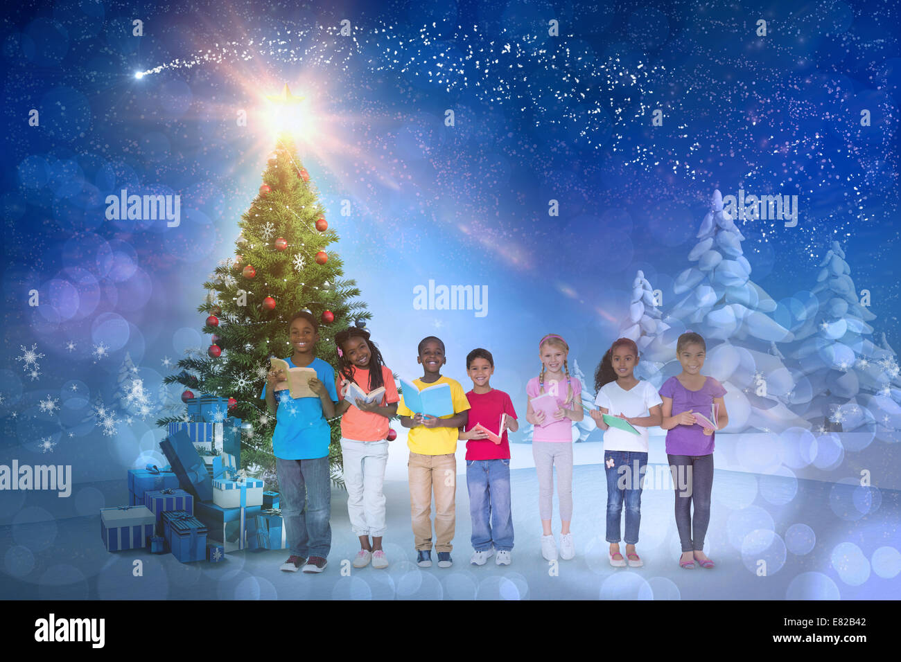 Composite image of cute children smiling at camera Stock Photo - Alamy