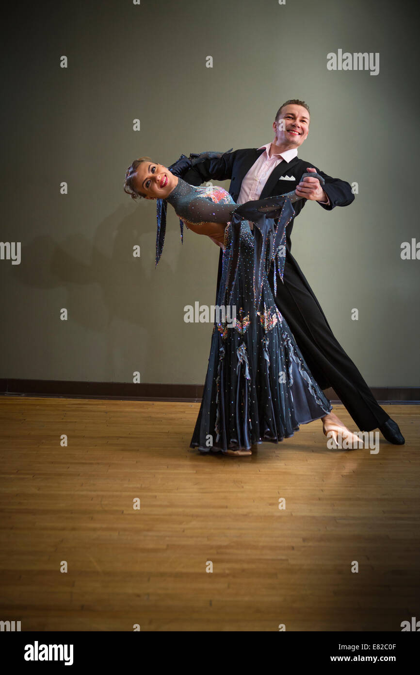 A man and woman dancing together in a dance studio. Stock Photo