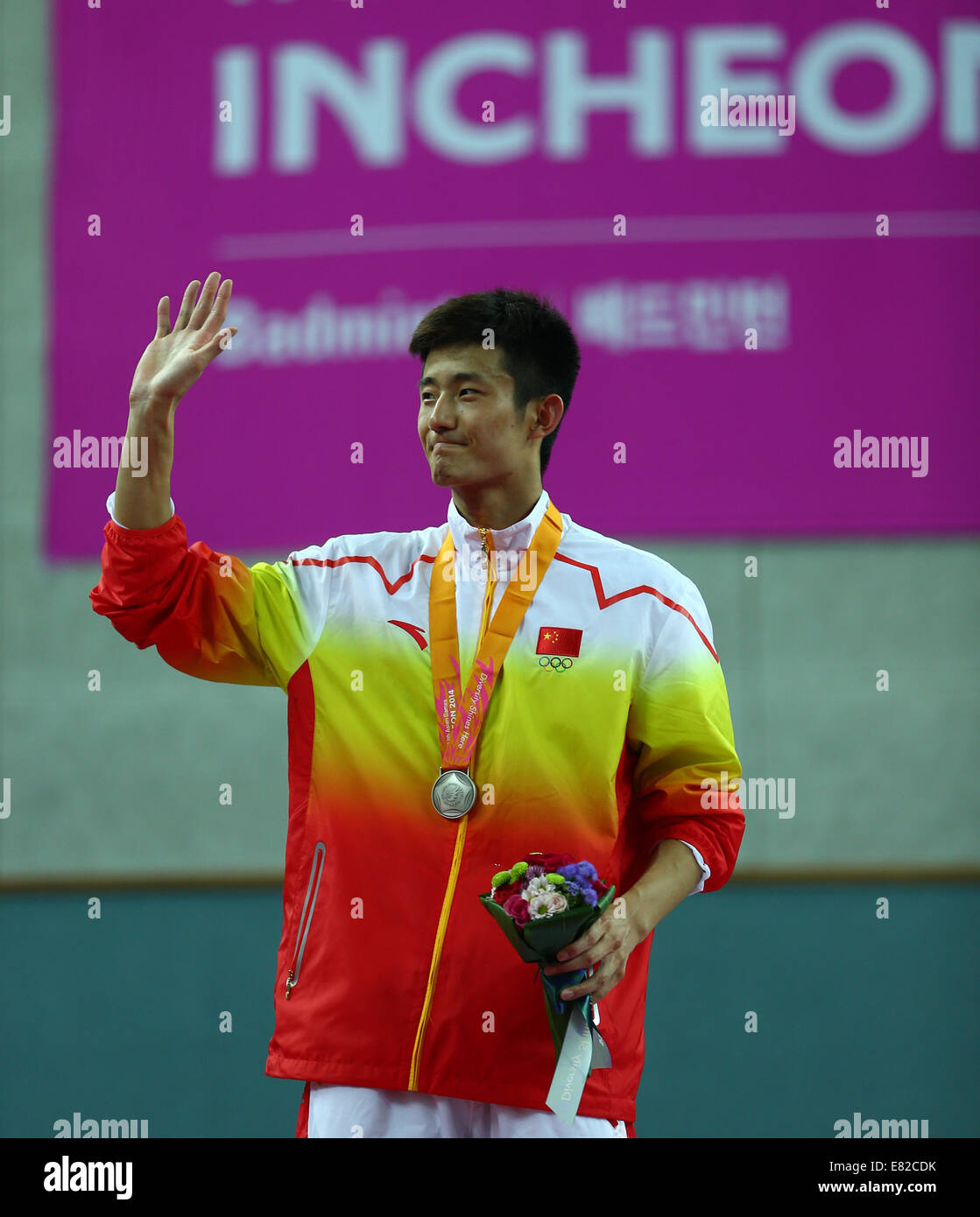 Incheon, South Korea. 29th Sep, 2014. Silver medalist Chen Long of China poses during the awarding ceremony of the men's singles contest of badminton at the 17th Asian Games in Incheon, South Korea, Sept. 29, 2014. © Fei Maohua/Xinhua/Alamy Live News Stock Photo
