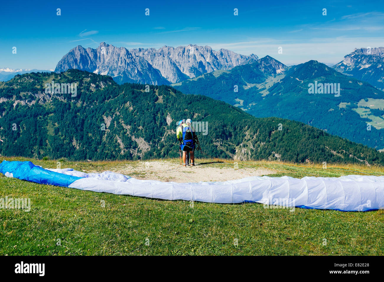 Tandem Paraglider preparin to take off on Unterberg mountain in Kossen, Tirol, Austria Stock Photo