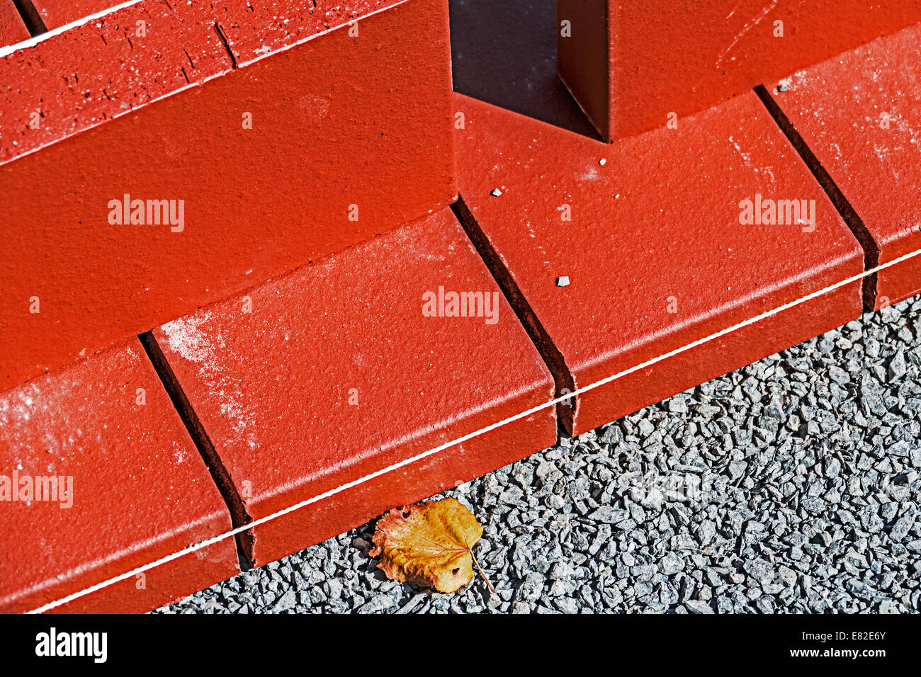 Ornamental paving bricks at a construction site in progress. Stock Photo