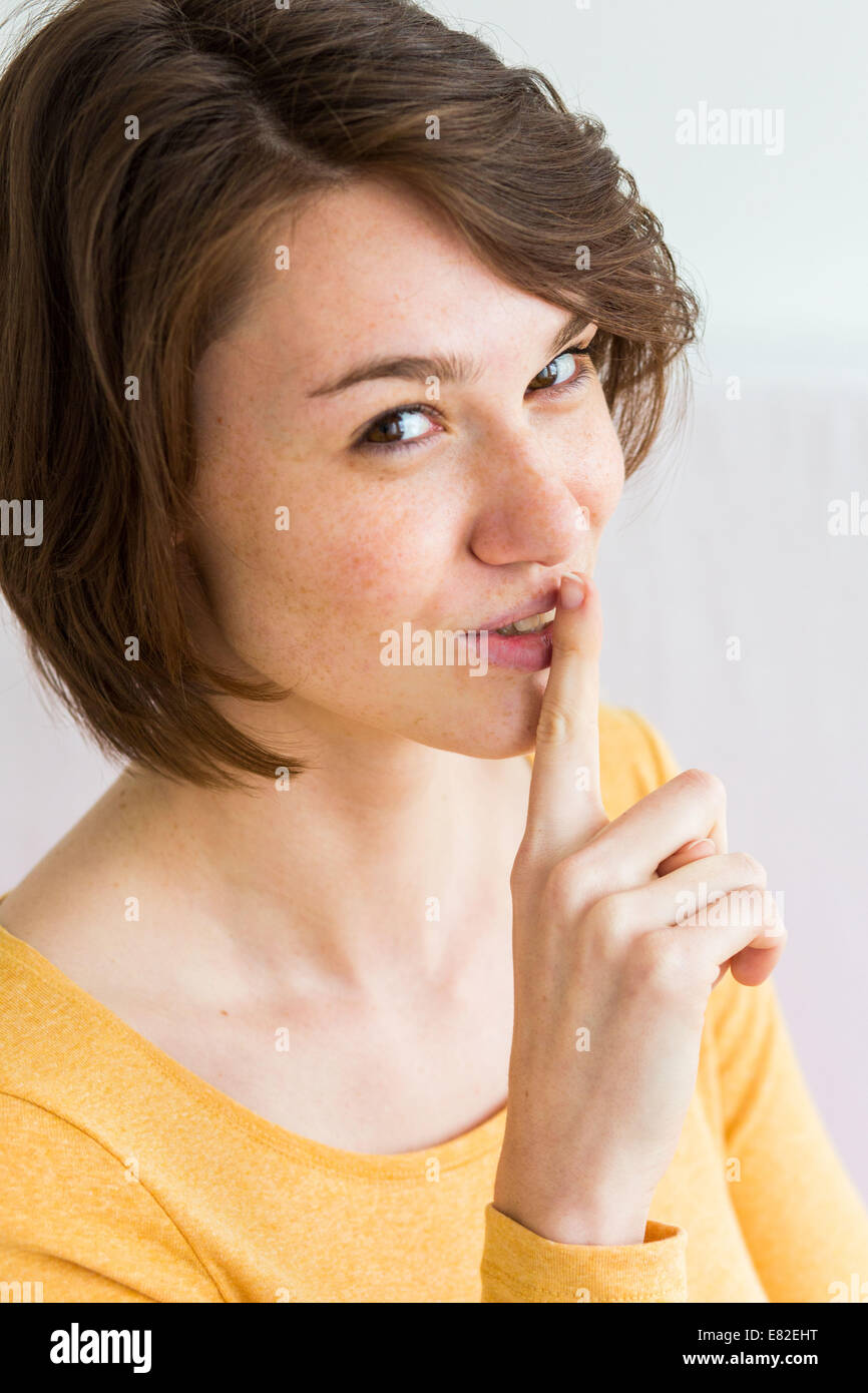 Woman signing to be silent. Stock Photo