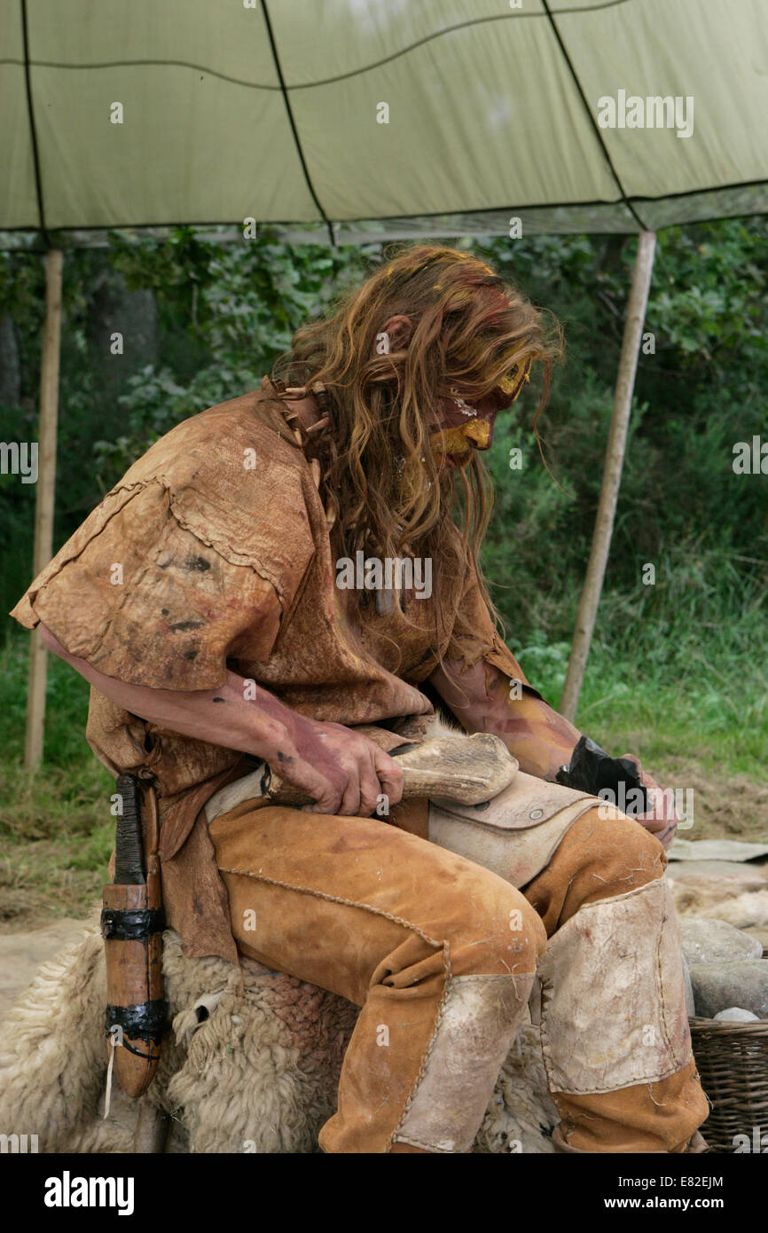 Stone Age flint napping demonstration Stock Photo