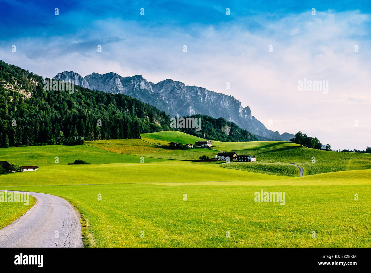 Alpine road with Zahmer Kaiser in the Background, Kaiserwinkl, Tirol, Austria Stock Photo