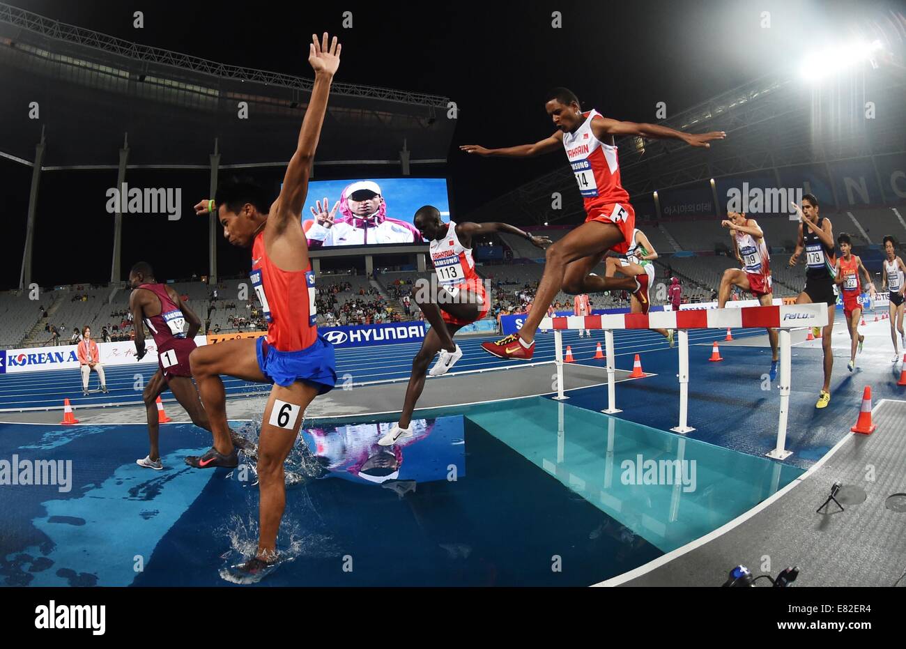 Incheon, South Korea. 29th Sep, 2014. Athletes compete during the men's 3,000m steeplechase final match of athletics at the 17th Asian Games in Incheon, South Korea, Sept. 29, 2014. Kamal Abubaker Ali of Qatar won the gold medal. © Lin Yiguang/Xinhua/Alamy Live News Stock Photo