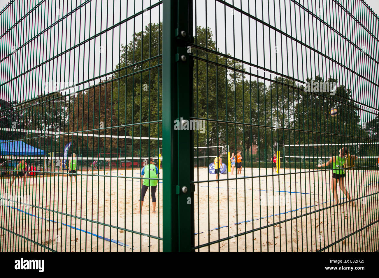 Wire fencing around a park beach volleyball court Stock Photo Alamy