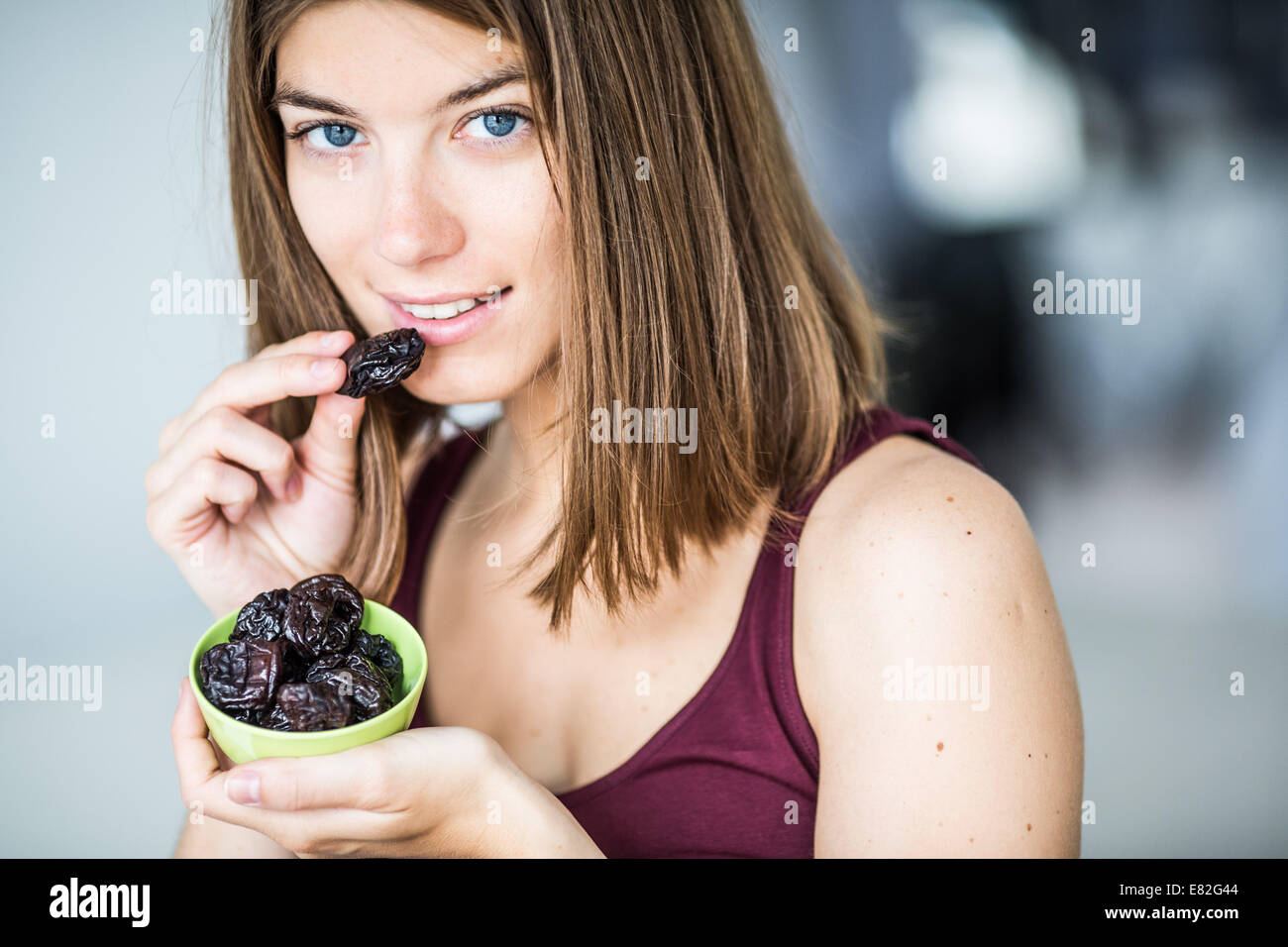 Woman eating prunes Stock Photo Alamy