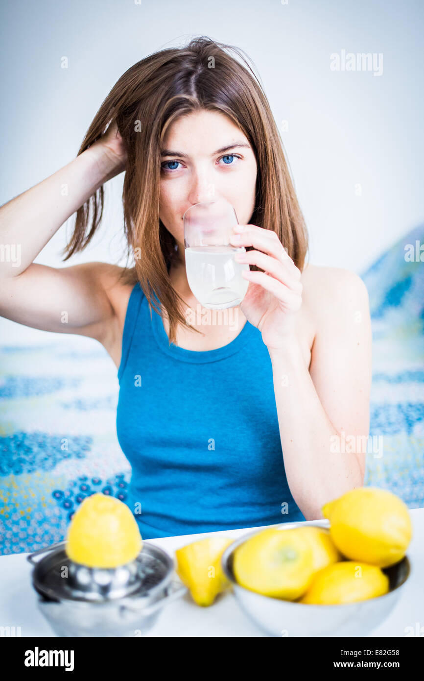 Woman drinking freshly squeezed lemon juice Stock Photo Alamy