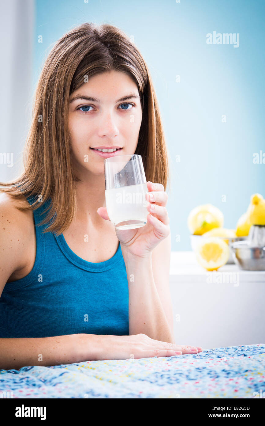 Woman drinking freshly squeezed lemon juice Stock Photo Alamy