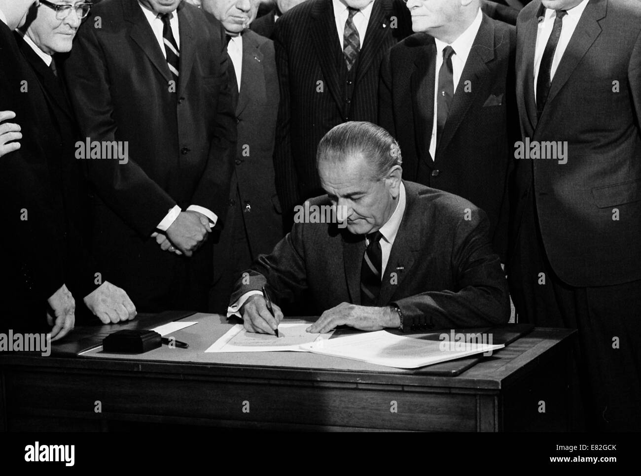 President Lyndon Baines Johnson signs the 1968 Civil Rights Bill. April 11, 1968 Stock Photo