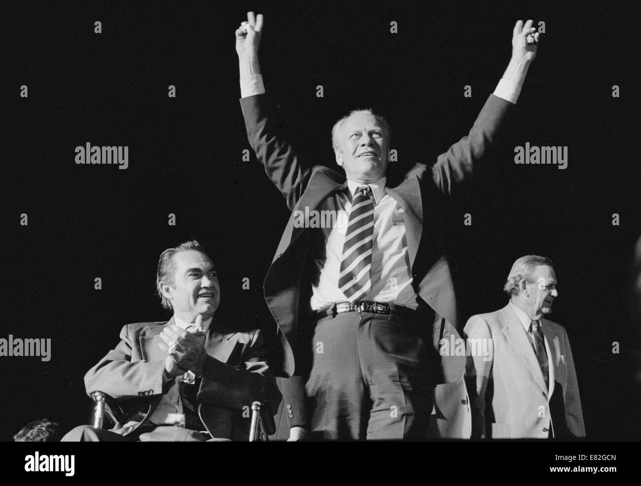 President Gerald Ford makes a victory sign as George Wallace applauds at a campaign stop in the South. September 1976 Stock Photo