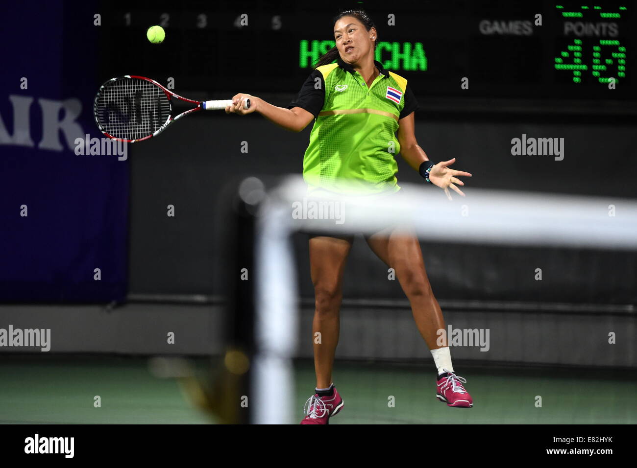 Incheon, South Korea. 29th Sep, 2014. Tanasugarn Tamarine of Thailand returns the ball during the women's doubles gold medal match of tennis against Hsieh Su Wei and Chan Chin Wei of Chinese Taipei at the 17th Asian Games in Incheon, South Korea, Sept. 29, 2014. Thailand defeated Chinese Taipei 2-1 and claimed the title. © Gao Jianjun/Xinhua/Alamy Live News Stock Photo