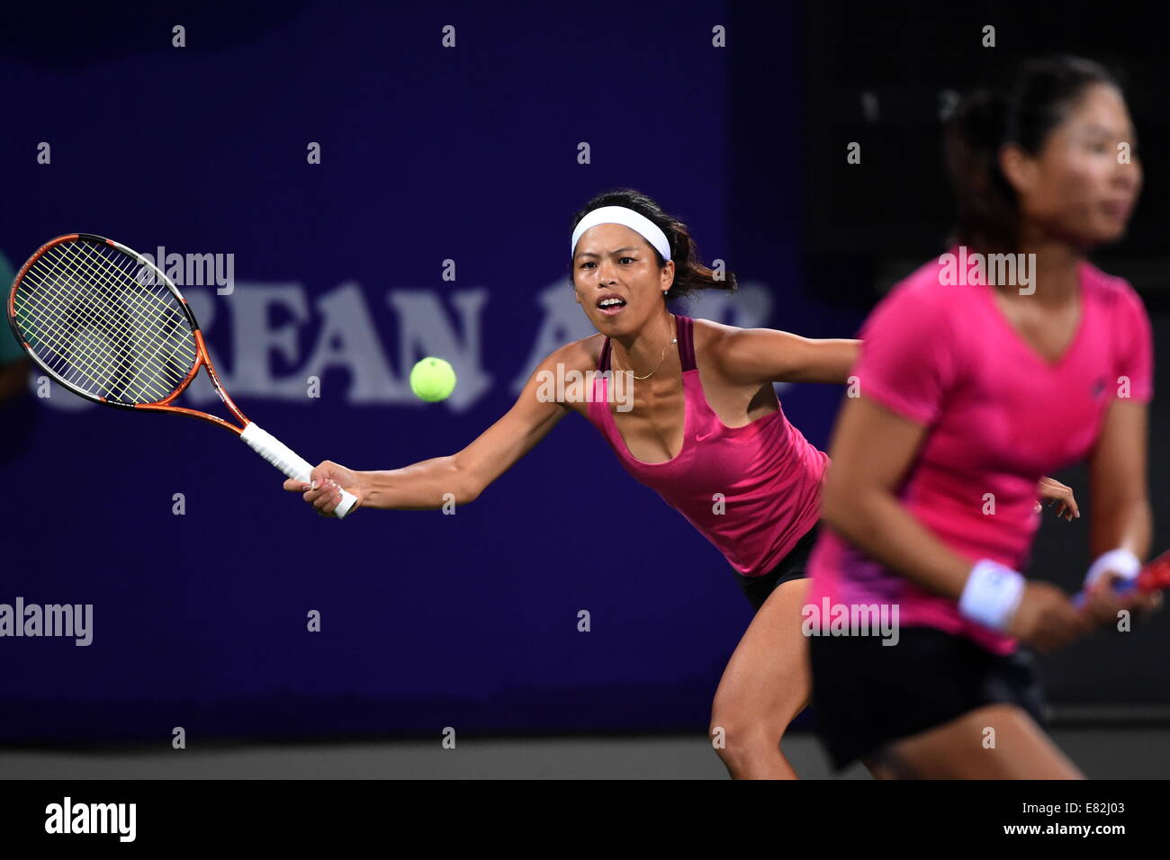 Incheon, South Korea. 29th Sep, 2014. Hsieh Su Wei (L) of Chinese Taipei returns the ball during the women's doubles gold medal match of tennis against Kumkhum Luksika and Tanasugarn Tamarine of Tailand at the 17th Asian Games in Incheon, South Korea, Sept. 29, 2014. Thailand defeated Chinese Taipei 2-1 and claimed the title. © Gao Jianjun/Xinhua/Alamy Live News Stock Photo