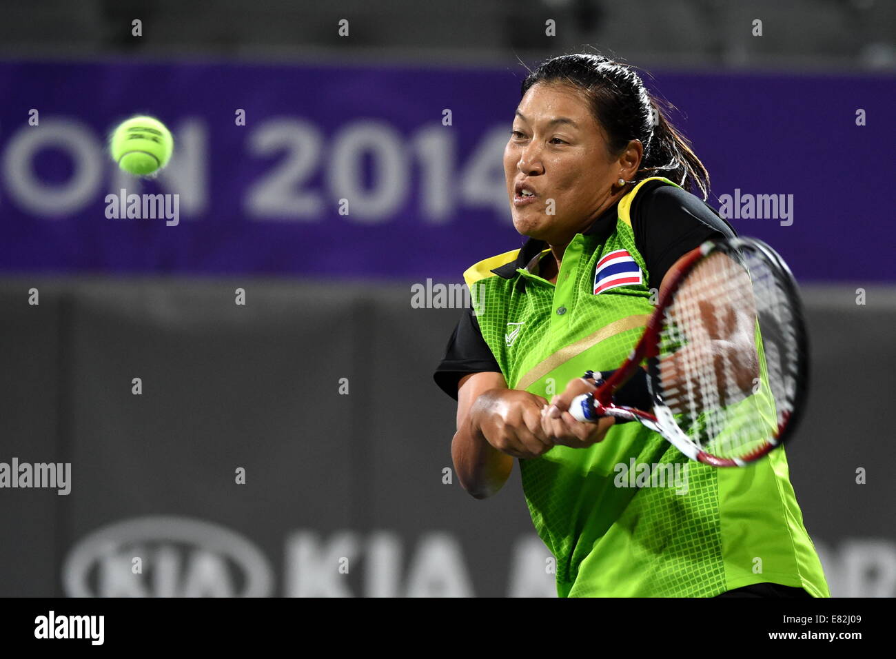 Incheon, South Korea. 29th Sep, 2014. Tanasugarn Tamarine of Thailand returns the ball during the women's doubles gold medal match of tennis against Hsieh Su Wei and Chan Chin Wei of Chinese Taipei at the 17th Asian Games in Incheon, South Korea, Sept. 29, 2014. Thailand defeated Chinese Taipei 2-1 and claimed the title. © Gao Jianjun/Xinhua/Alamy Live News Stock Photo