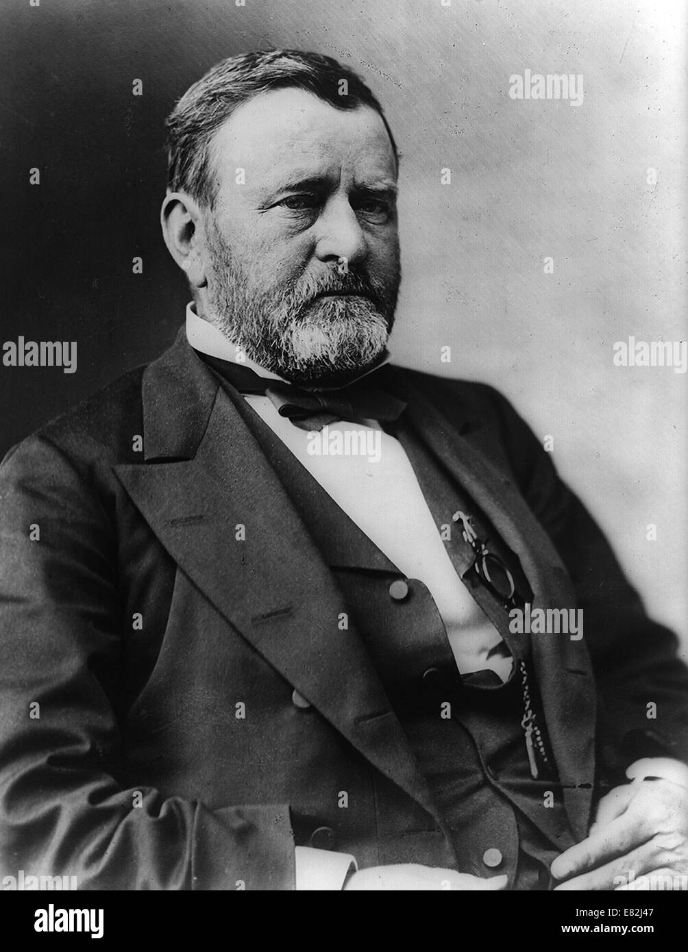 President Ulysses S. Grant, half-length portrait, seated, facing right. Between 1869 and 1885 Stock Photo