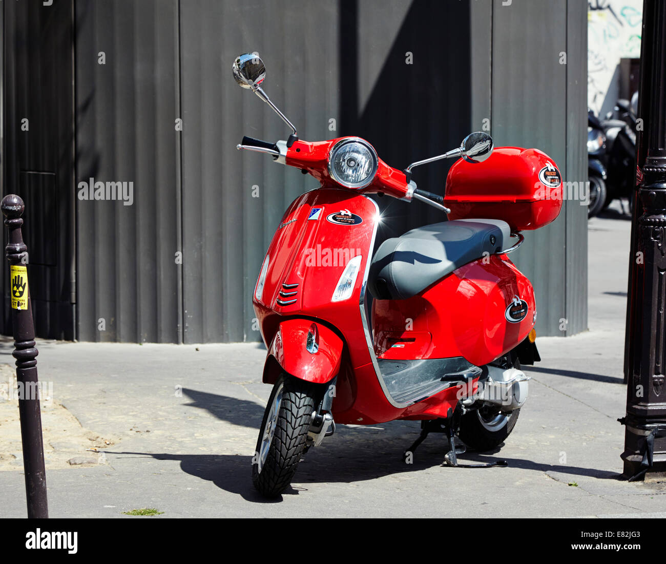 Red shiny Vespa scooter in Paris Stock Photo - Alamy