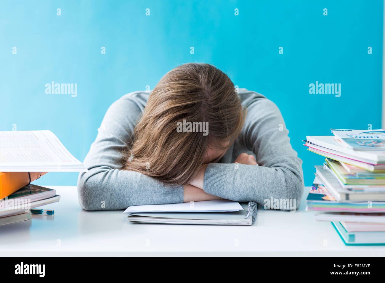 Teenage girl revising exams. Stock Photo